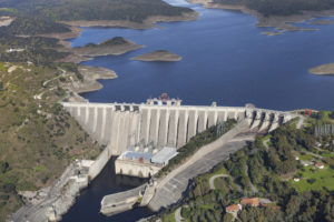The Alcántara Dam, also known as the José María de Oriol Dam, is a buttress dam on the Tagus River near Alcántara in the province of Cáceres, Spain. It is named after the politician and captain of the Spanish electricity industry José María de Oriol y Urquijo. The dam regulates much of the flow of the Tagus River, the longest of the Iberian Peninsula. It was built in 1969 and is the second largest reservoir in Europe.